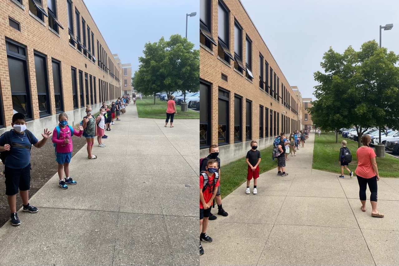 students lined up with masks outside a building